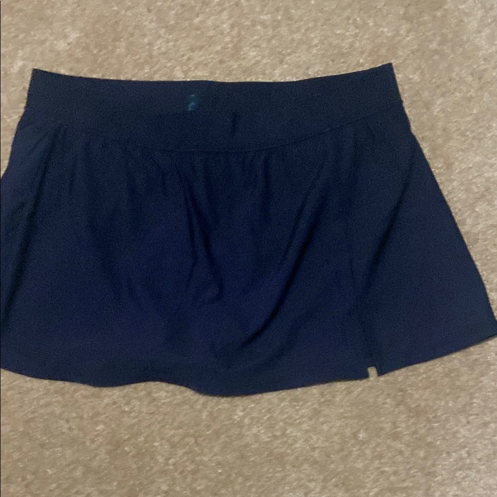 Women’s black swim skirt. New condition. Size Large. Aqua Green brand.